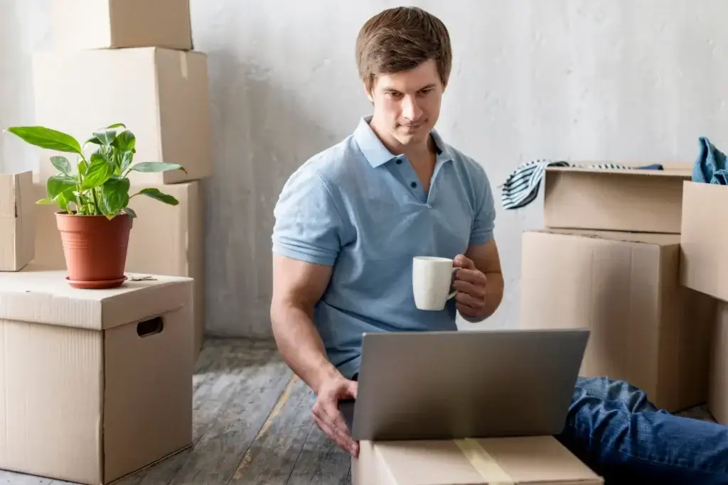 Man searching online to find out which moving company to hire in Jersey City.